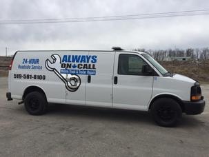 Fleet technician inspecting service vehicles